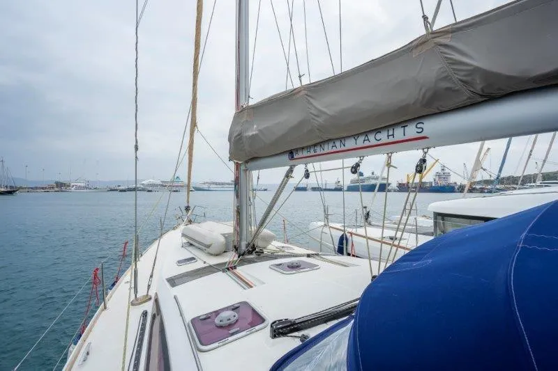  Yacht Photos Pics 2010 Jeanneau 53 sailboat docked in a marina, featuring a spacious deck.