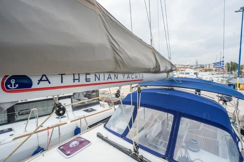  Yacht Photos Pics 2010 Jeanneau 53 sailboat by Athenian Yachts, docked in a marina.
