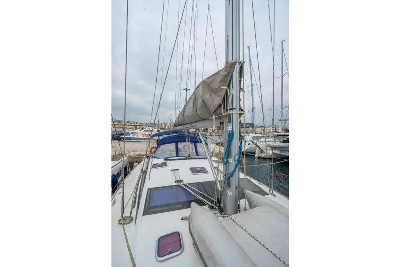  Yacht Photos Pics 2010 Jeanneau 53 sailboat docked at marina, featuring mast and deck view.