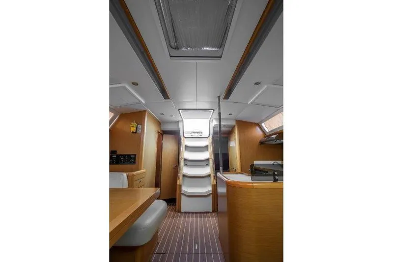  Yacht Photos Pics Interior of 2010 Jeanneau 53 yacht, featuring modern wood finishes and sleek design.