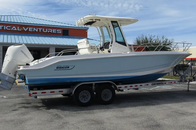  Yacht Photos Pics 2023 Boston Whaler 280 Dauntless boat on trailer outside Nautical Ventures store.