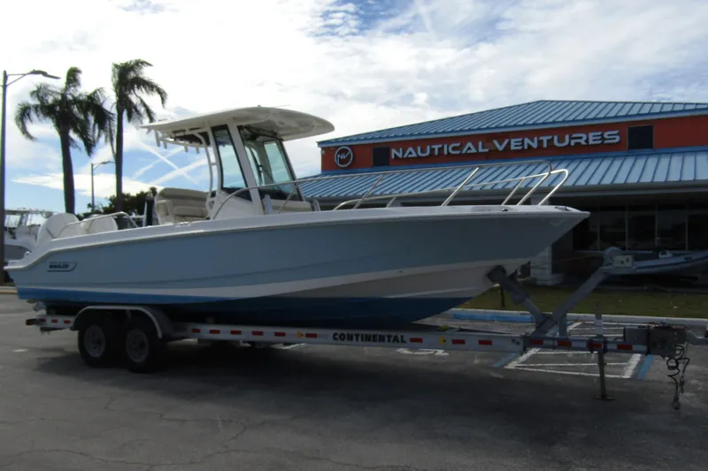  Yacht Photos Pics 2023 Boston Whaler 280 Dauntless boat on trailer at Nautical Ventures dealership.
