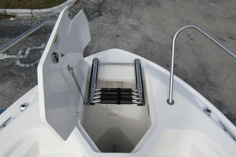  Yacht Photos Pics 2023 Boston Whaler 280 Dauntless bow storage with ladder and open hatch.