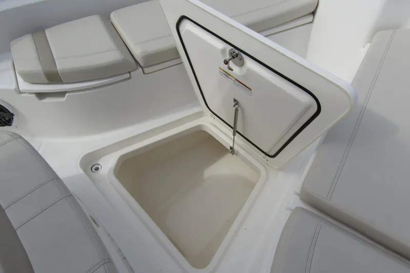  Yacht Photos Pics 2023 Boston Whaler 280 Dauntless storage compartment with cushioned seating.