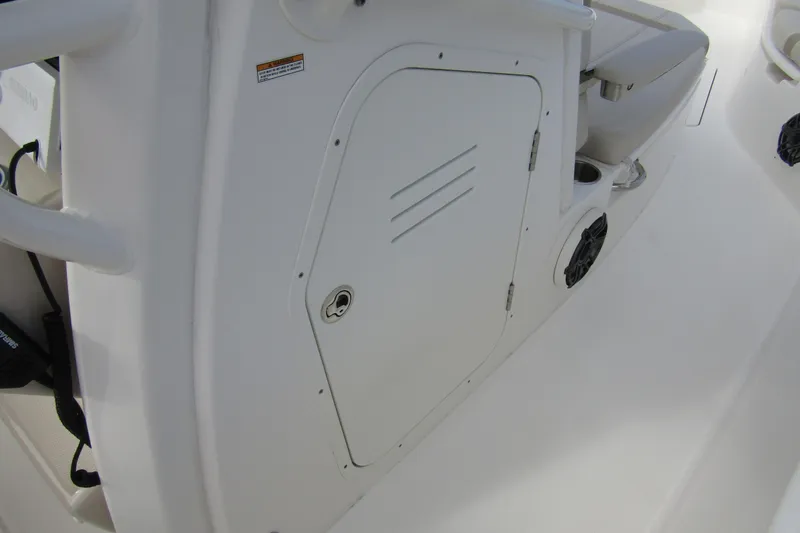  Yacht Photos Pics 2023 Boston Whaler 280 Dauntless interior detail with storage compartment and seating.