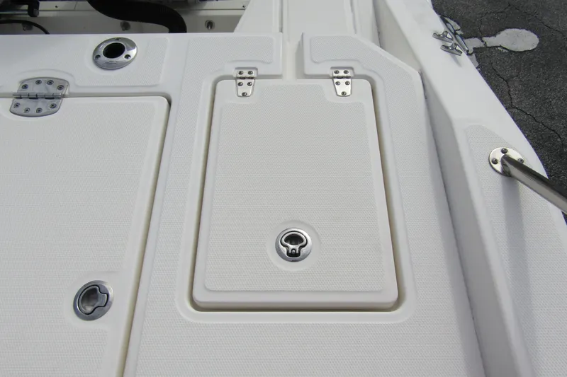  Yacht Photos Pics 2023 Boston Whaler 280 Dauntless deck with storage compartments and stainless steel fittings.