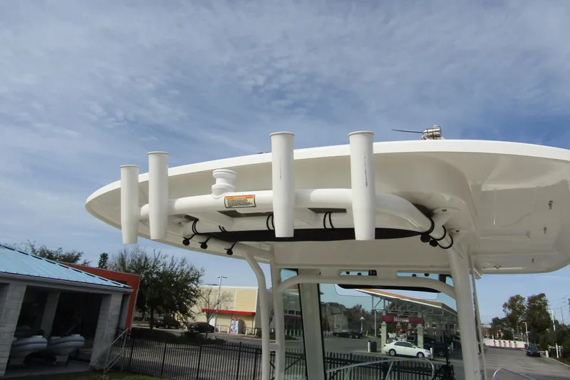  Yacht Photos Pics 2023 Boston Whaler 280 Dauntless boat top view with rod holders and clear sky.