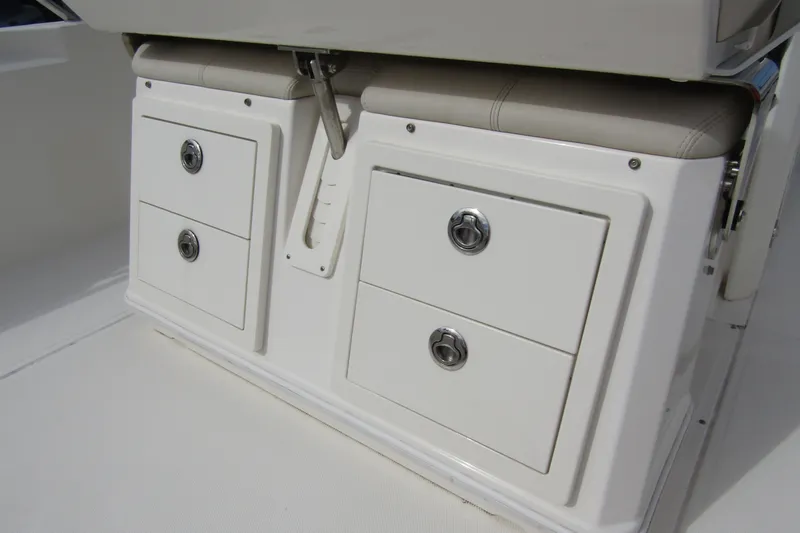  Yacht Photos Pics Storage drawers on a 2023 Boston Whaler 280 Dauntless boat, featuring sleek design and functionality.