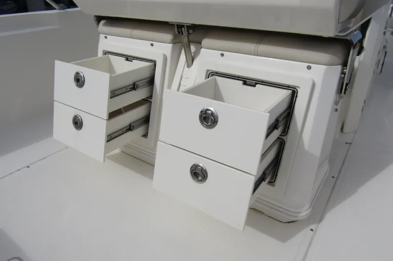  Yacht Photos Pics Storage drawers on 2023 Boston Whaler 280 Dauntless boat, showcasing sleek design and functionality.