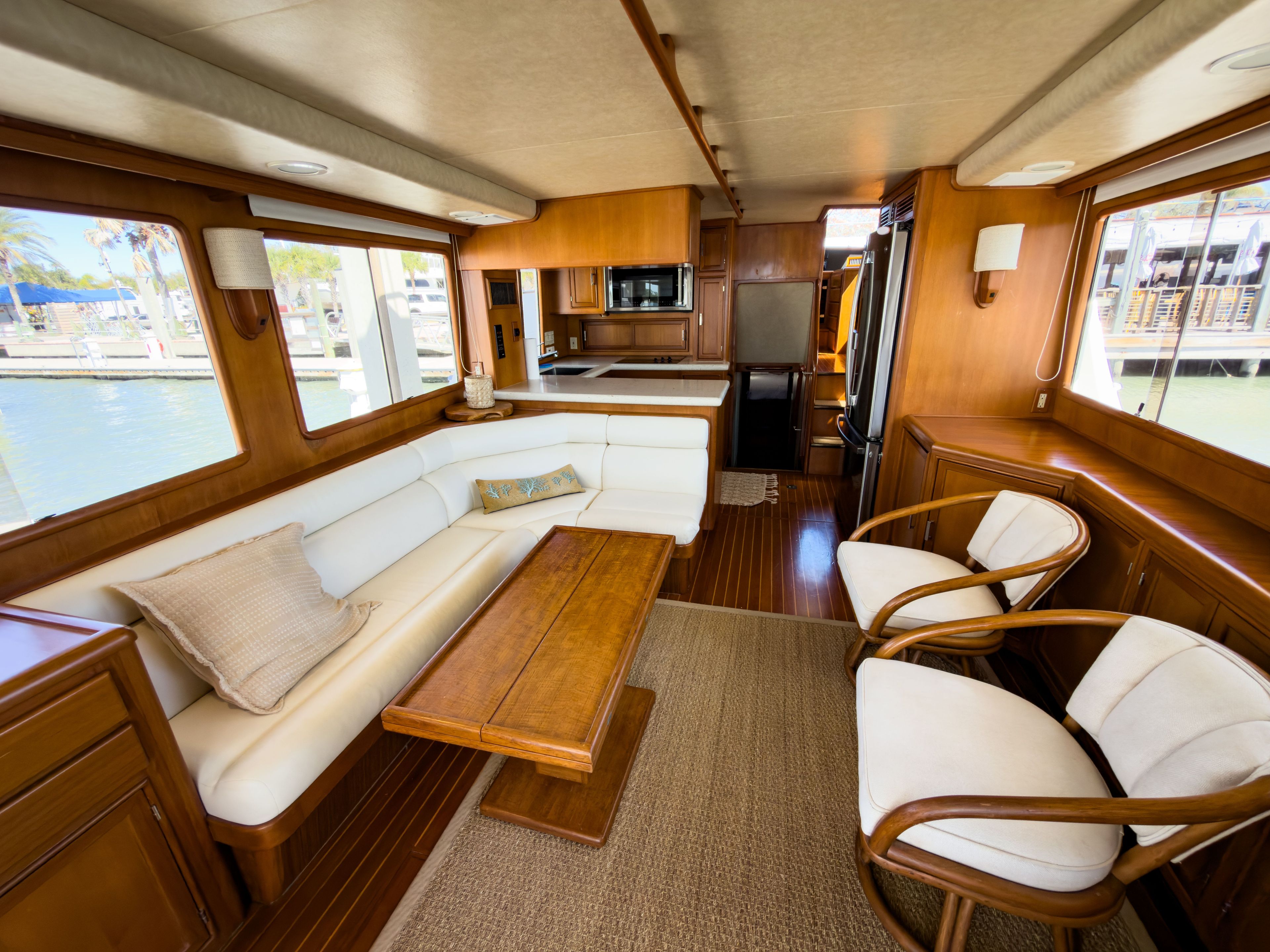 Interior of a 1996 Fleming 55 yacht with elegant wood furnishings.