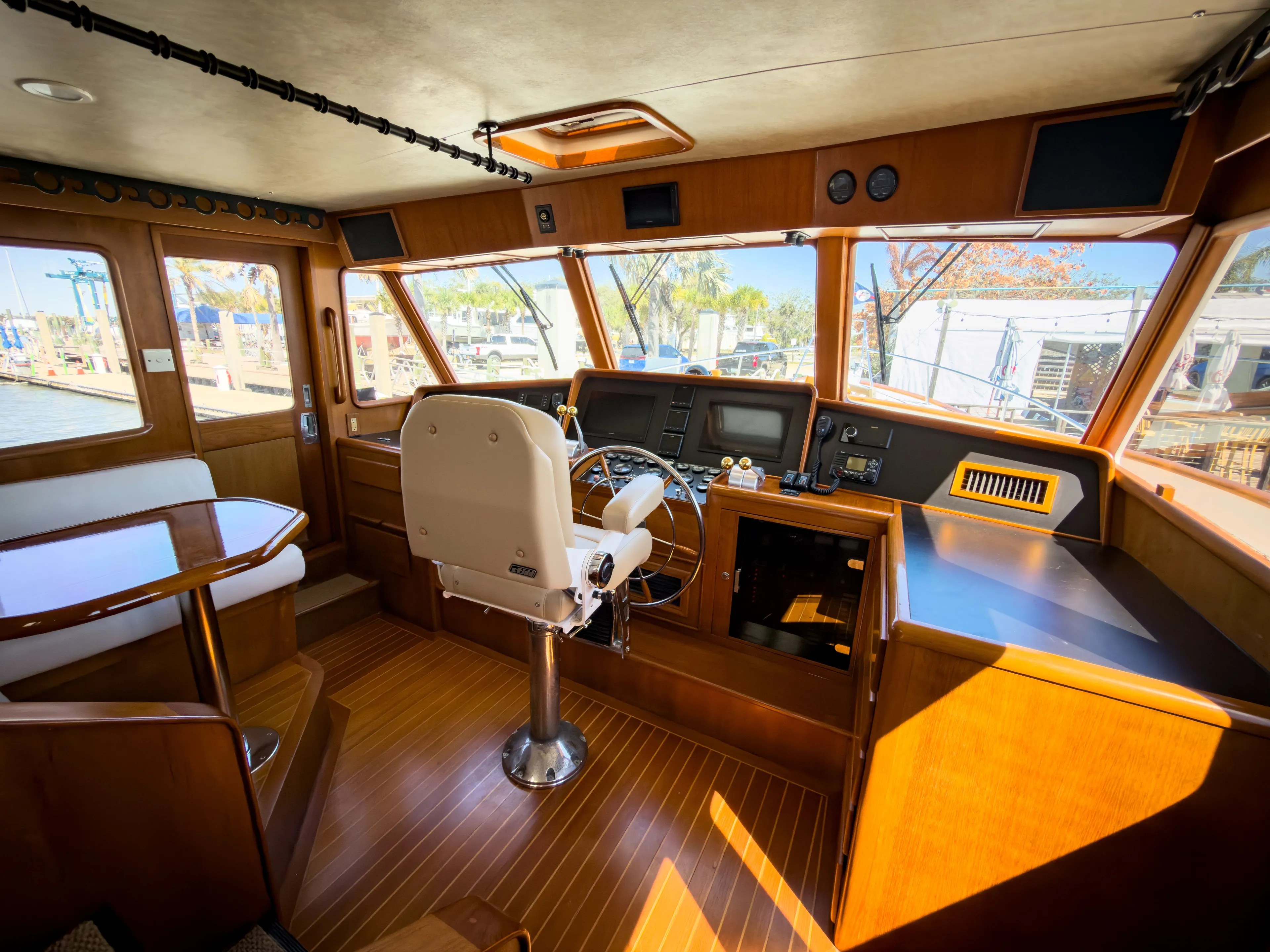 Interior of a 1996 Fleming 55 yacht, featuring helm and wood finish.