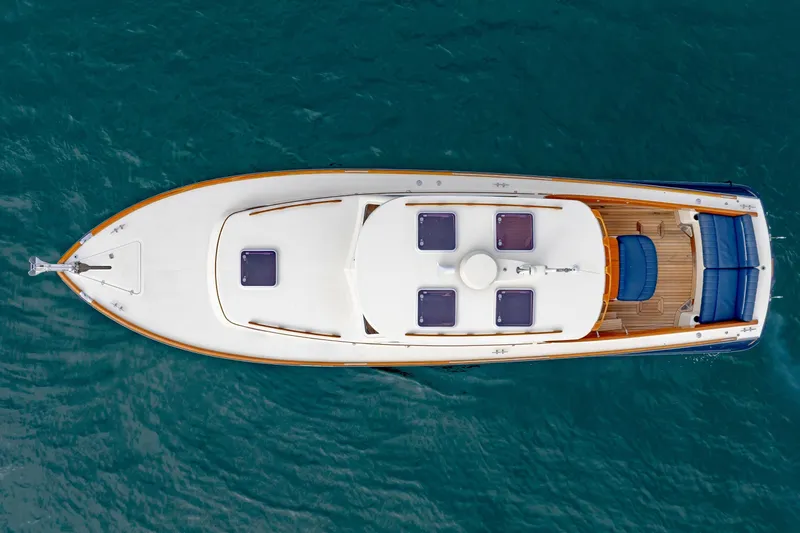 Lab Adore Yacht Photos Pics Top view of 2003 Hinckley Picnic Boat EP on blue water.