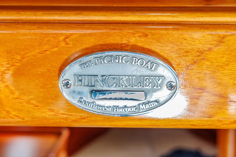Lab Adore Yacht Photos Pics Hinckley Picnic Boat EP 2003 nameplate on polished wood, Southwest Harbor, Maine.