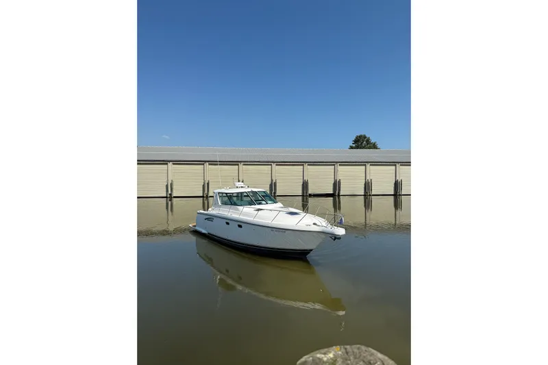  Yacht Photos Pics 2005 Tiara Yachts 3600 Sovran docked in calm waters under clear blue sky.