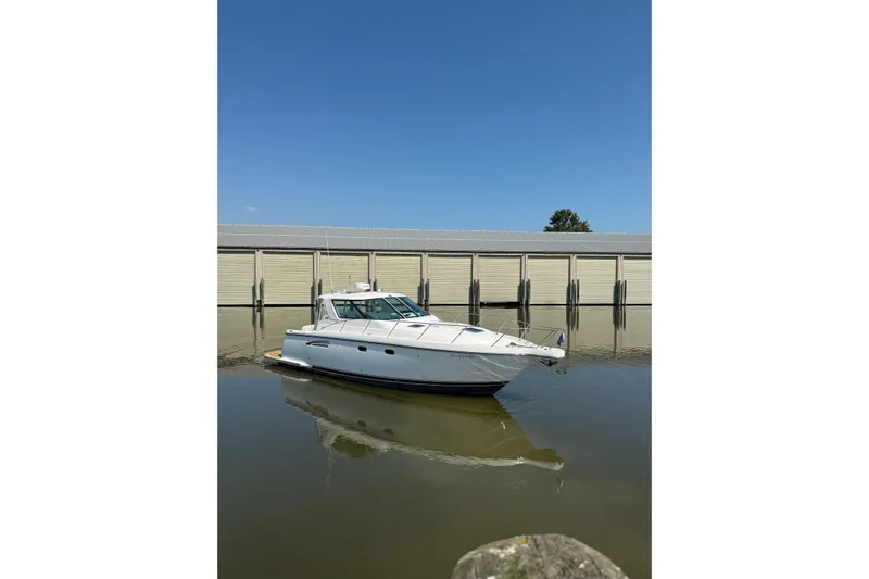  Yacht Photos Pics 2005 Tiara Yachts 3600 Sovran docked on calm water under clear blue sky.
