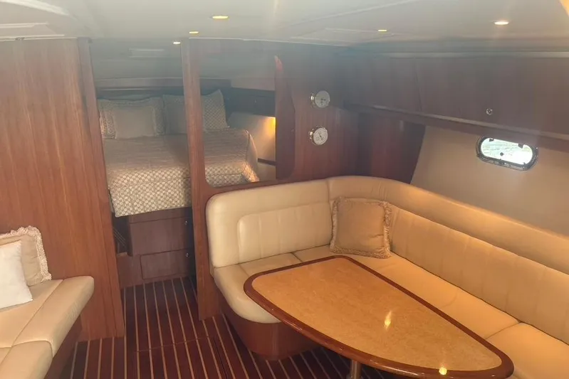  Yacht Photos Pics 2005 Tiara Yachts 3600 Sovran interior with cozy seating and elegant wood finish.