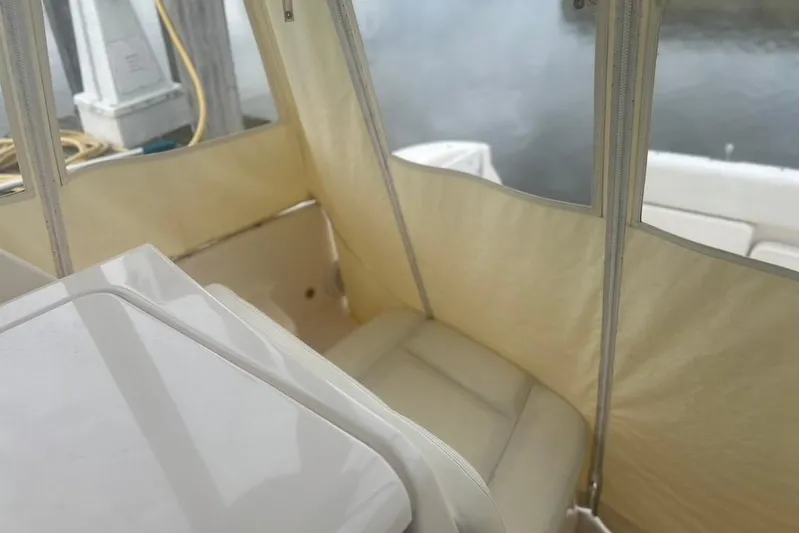  Yacht Photos Pics 2005 Tiara Yachts 3600 Sovran interior with beige seating and clear enclosure.
