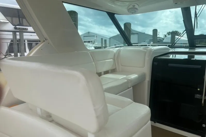  Yacht Photos Pics Interior of 2005 Tiara Yachts 3600 Sovran, featuring white seating and large windows.