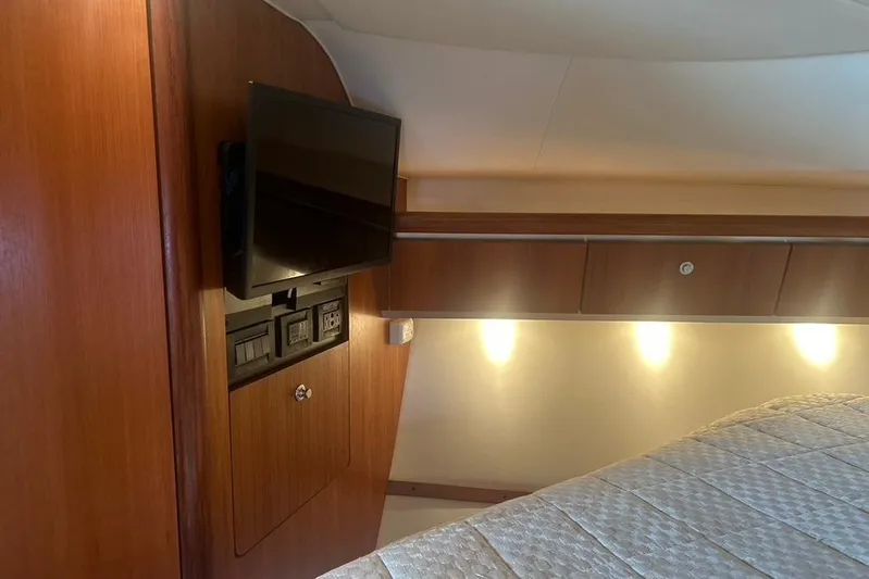  Yacht Photos Pics 2005 Tiara Yachts 3600 Sovran interior with TV, wood paneling, and ambient lighting.