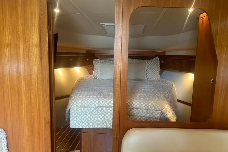  Yacht Photos Pics Luxurious cabin interior of 2005 Tiara Yachts 3600 Sovran with cozy bedding.