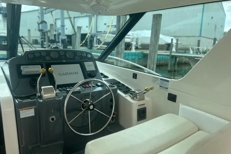  Yacht Photos Pics 2005 Tiara Yachts 3600 Sovran helm with Garmin navigation system and steering wheel.