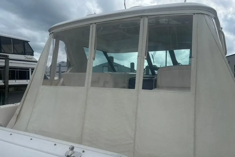  Yacht Photos Pics 2005 Tiara Yachts 3600 Sovran with enclosed cockpit, docked at marina.