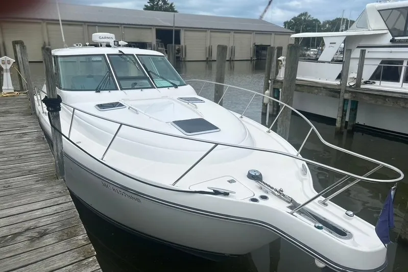  Yacht Photos Pics 2005 Tiara Yachts 3600 Sovran docked at marina, showcasing sleek design and modern features.