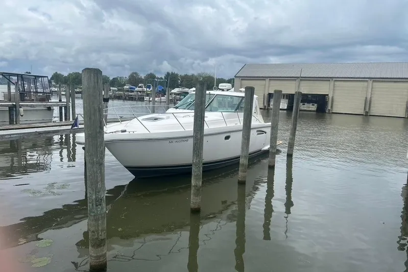  Yacht Photos Pics 2005 Tiara Yachts 3600 Sovran docked at a marina under cloudy skies.
