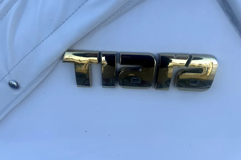  Yacht Photos Pics Tiara Yachts 3600 Sovran 2005 emblem on white surface.