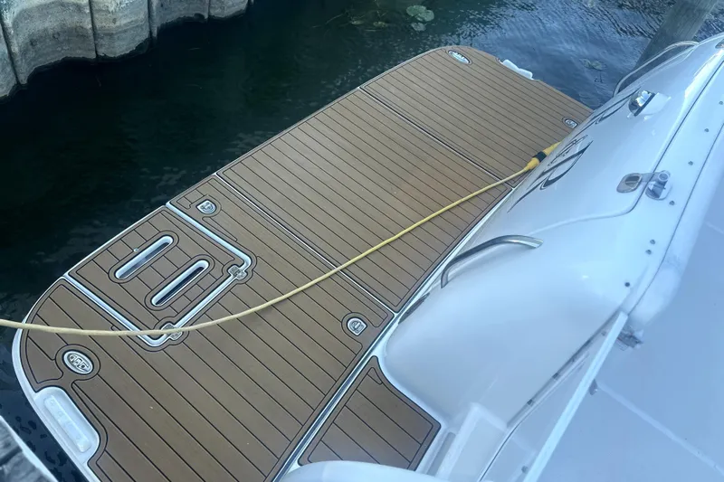 Yacht Photos Pics 2005 Tiara Yachts 3600 Sovran swim platform with teak decking by the water.