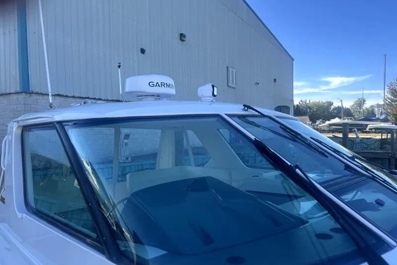  Yacht Photos Pics 2005 Tiara Yachts 3600 Sovran with Garmin radar, docked near a warehouse.