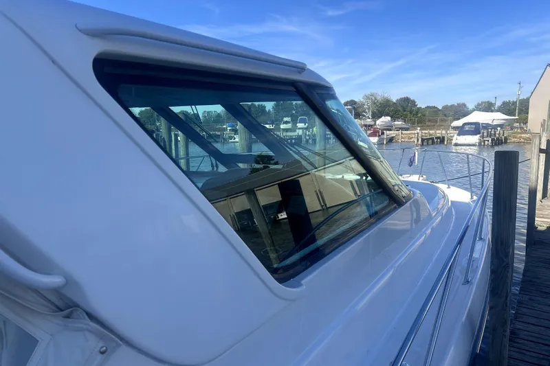  Yacht Photos Pics 2005 Tiara Yachts 3600 Sovran docked, showcasing sleek design and marina backdrop.