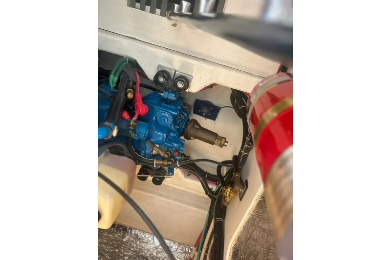  Yacht Photos Pics Engine compartment of a 2005 Tiara Yachts 3600 Sovran, featuring blue machinery and wiring.