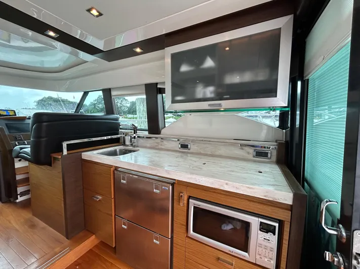  Yacht Photos Pics Interior of 2015 Tiara Yachts C44 Coupe with modern kitchen amenities.