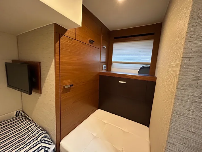  Yacht Photos Pics 2015 Tiara Yachts C44 Coupe interior cabin with wood paneling and cozy seating.