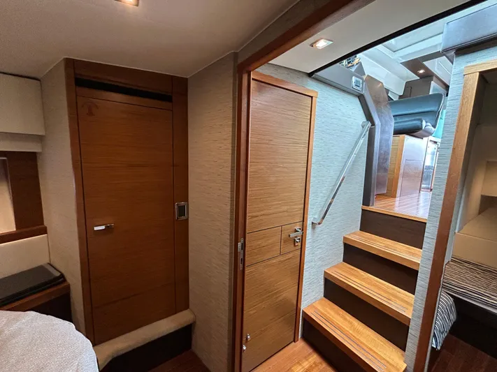  Yacht Photos Pics Interior of 2015 Tiara Yachts C44 Coupe, featuring wooden doors and stairs.