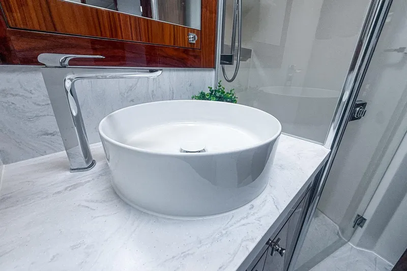 Frivolous Yacht Photos Pics Modern bathroom sink in 2021 Riviera 5400 Sport Yacht Platinum Edition, featuring sleek design.