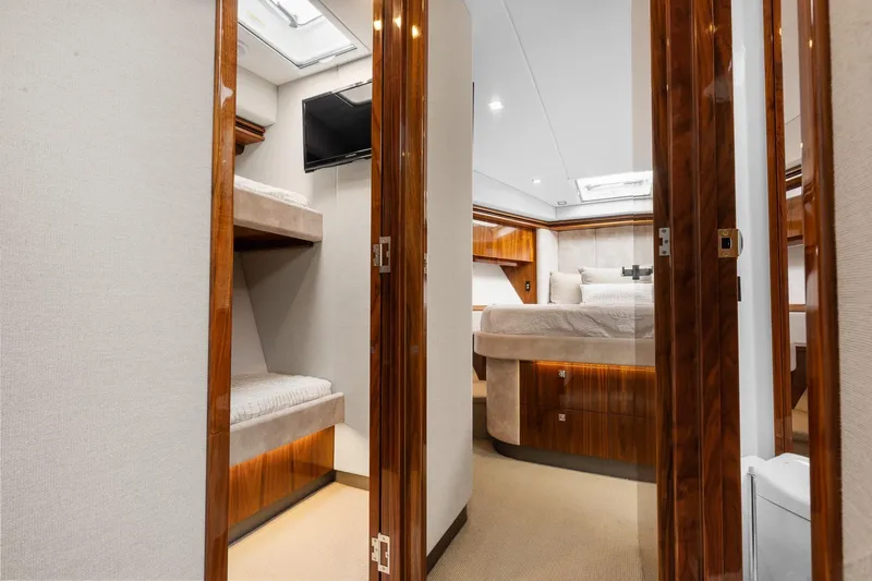 Frivolous Yacht Photos Pics Luxurious interior of 2021 Riviera 5400 Sport Yacht Platinum Edition with elegant wood finishes.