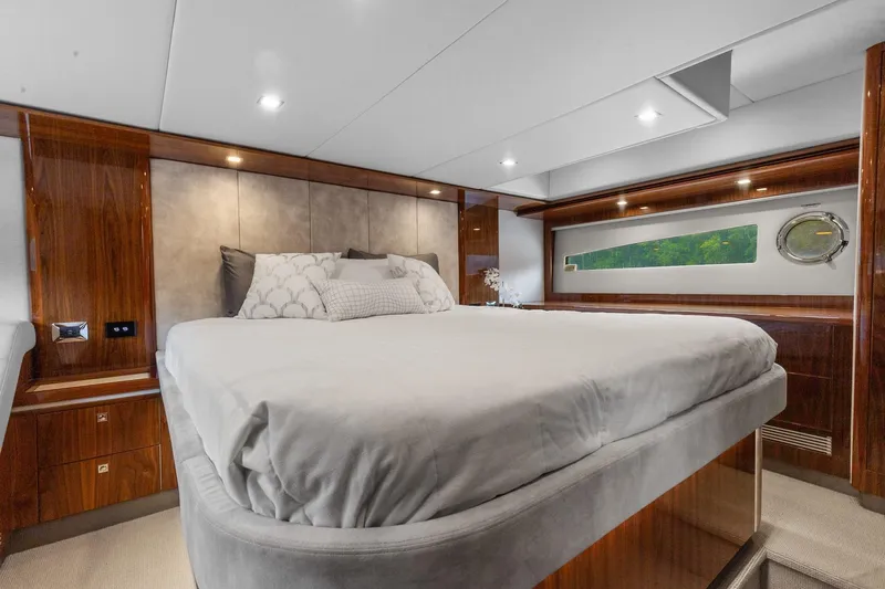 Frivolous Yacht Photos Pics Luxurious bedroom interior of 2021 Riviera 5400 Sport Yacht Platinum Edition.
