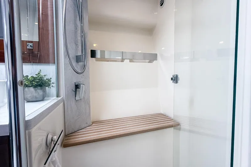 Frivolous Yacht Photos Pics Luxurious shower interior of 2021 Riviera 5400 Sport Yacht Platinum Edition.