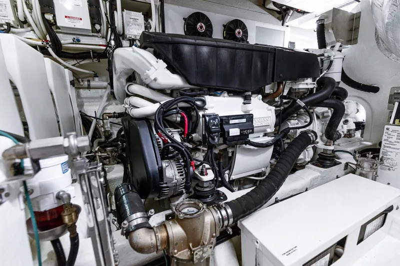 Frivolous Yacht Photos Pics Engine room of 2021 Riviera 5400 Sport Yacht Platinum Edition, showcasing advanced machinery and components.