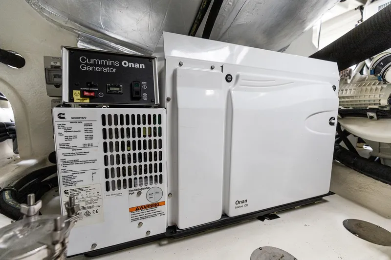 Frivolous Yacht Photos Pics Cummins Onan generator in 2021 Riviera 5400 Sport Yacht Platinum Edition engine room.