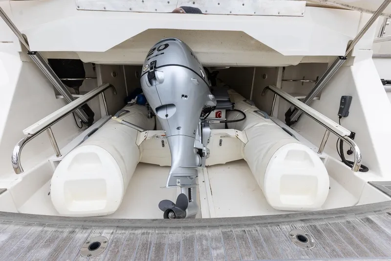 Frivolous Yacht Photos Pics 2021 Riviera 5400 Sport Yacht Platinum Edition with stored inflatable boat and motor.