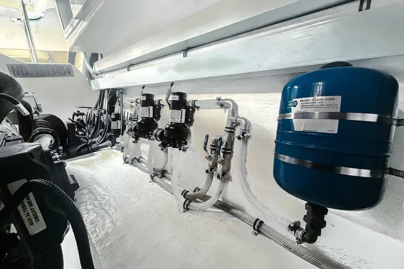 Frivolous Yacht Photos Pics Engine room of 2021 Riviera 5400 Sport Yacht Platinum Edition, featuring mechanical components.