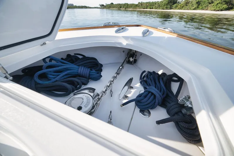  Yacht Photos Pics 2022 Valhalla Boatworks V-41 anchor locker with ropes and chain on calm water.