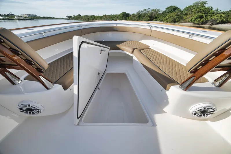  Yacht Photos Pics 2022 Valhalla Boatworks V-41 interior with open storage compartment and cushioned seating.