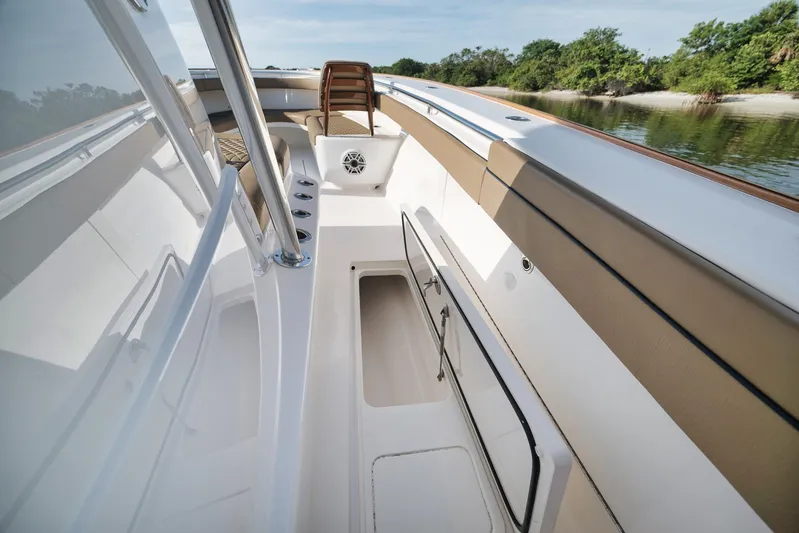  Yacht Photos Pics 2022 Valhalla Boatworks V-41 interior with storage compartment, sleek design, and scenic water view.