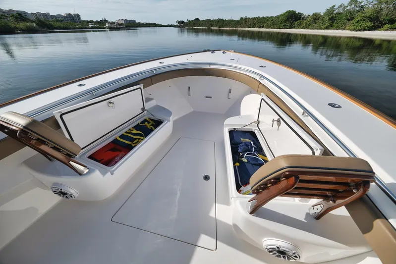  Yacht Photos Pics 2022 Valhalla Boatworks V-41 interior with open storage compartments on calm water.