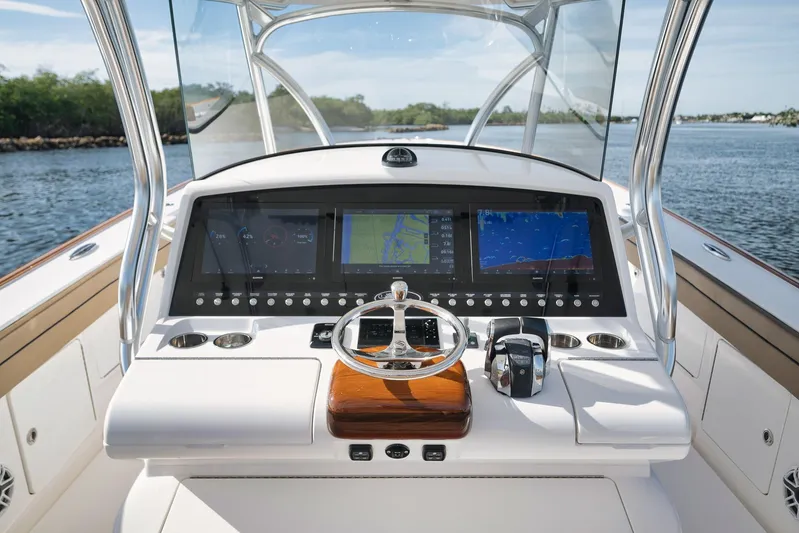  Yacht Photos Pics 2022 Valhalla Boatworks V-41 helm with advanced navigation displays on open water.
