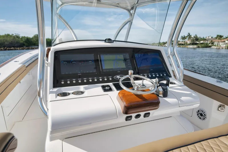  Yacht Photos Pics 2022 Valhalla Boatworks V-41 helm with advanced navigation displays and steering wheel.